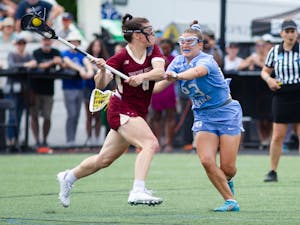 Fifth year defender Emma Trenchard (23) defends fifth year attacker Charlotte North (8) during UNC's NCAA National Championship Final against Boston College at Homewood Field in Baltimore, Md. on Sunday, May 29, 2022. UNC won 12-11.