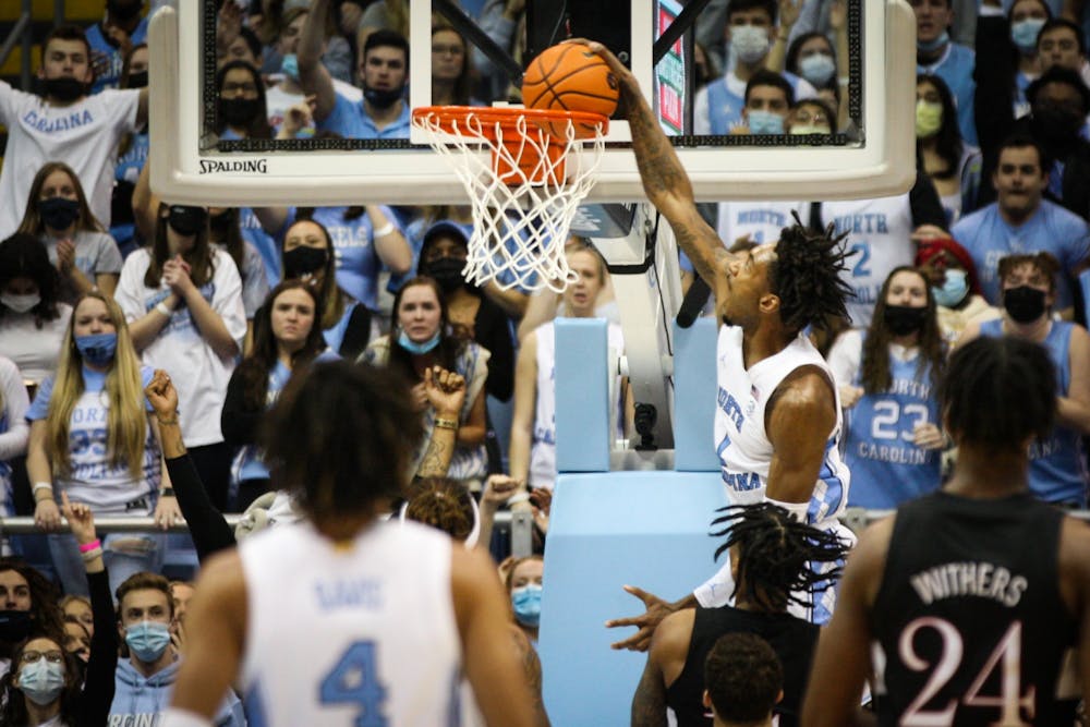 UNC senior forward Leaky Black (1) dunks the ball during a home men's basketball game against Louisville on Monday, Feb. 21, 2022. UNC won 70-63.