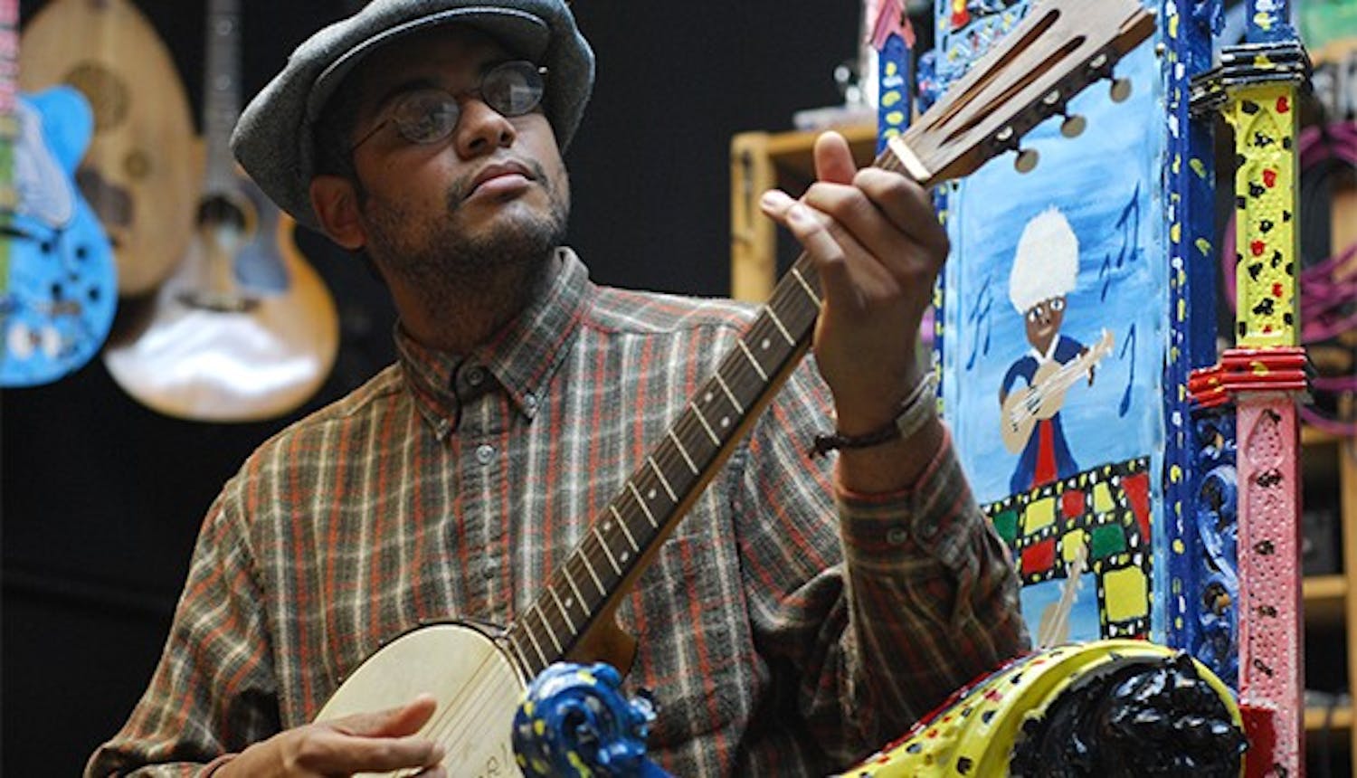 Profile are of Dom Flemons of the Carolina Chocolate Drops in his studio Music Maker Relief Foundation in Hillsborough. 