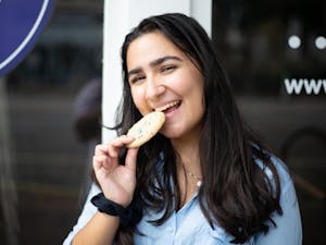 Editorial board member Layla Peykamian tries one of Insomnia Cookies' new vegan flavors.