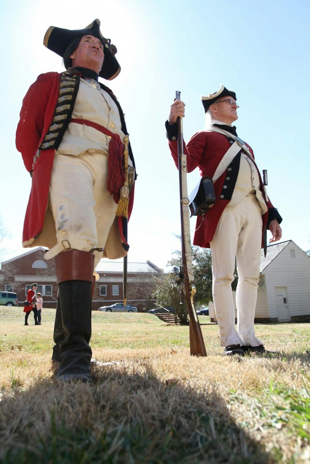 Revolutionary War reenactment as part of Twelfth Annual Revolutionary War Living History Day in Hillsborough Saturday 2-22-14. Reenactment of His Majesty's 64th regiment of foot during the year of 1781. Left- David Snyder is from Efland, reenacting a Captain of Infantry, been reenacting since 1976 and started because of the bicentennial. He has an interest in American history and wanted to learn more about the British side of the story. Here he speaks to a crowd about weapons, clothing, and strategies of war. Right- Ed Franz has been reenacting since 1995, when a friend encouraged him to "come out and play" in a historical period. He has loved learning about a time that he had previously been disinterested in.