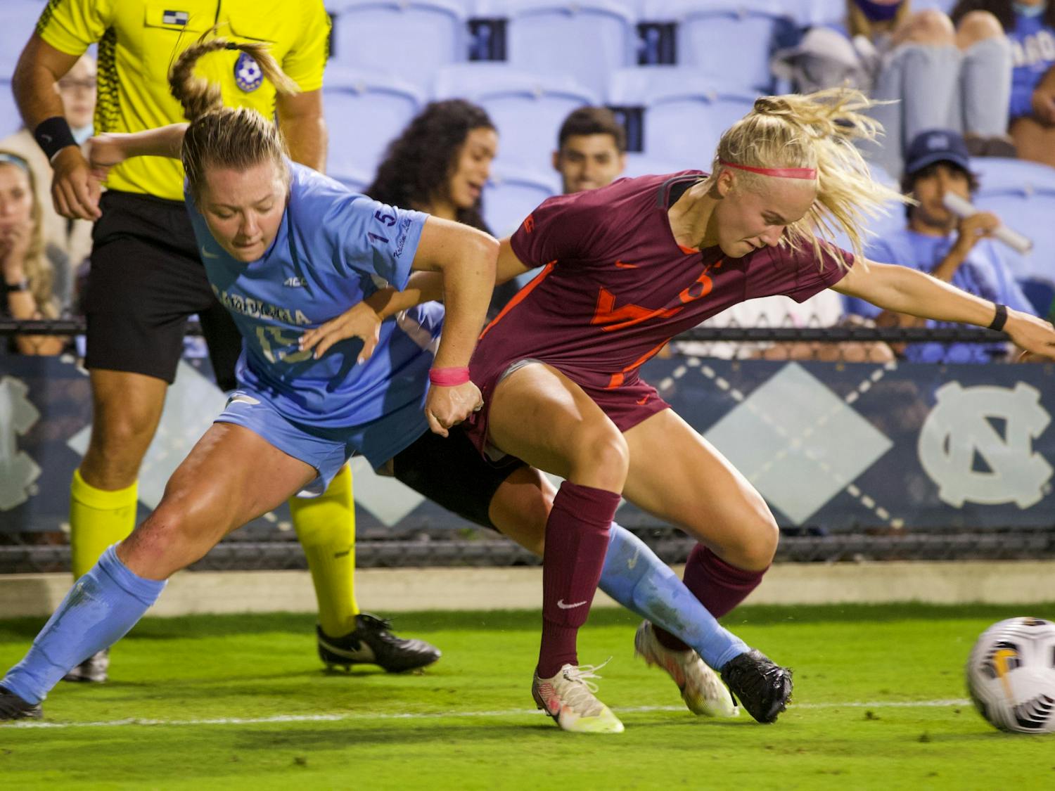 UNC sophomore forward Avery Patterson (15) attempts to retrieve the ball back from her opponent during a women's soccer game against Virginia Tech on Sept. 23, 2021, at Dorrance Field. UNC tied 2-2.