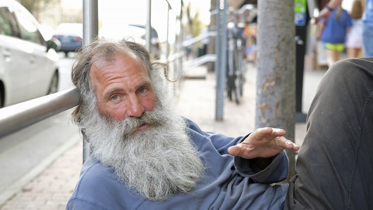 Neal, a panhandler on Franklin, sits in front of The Clothing Warehouse on April, 8 2015.