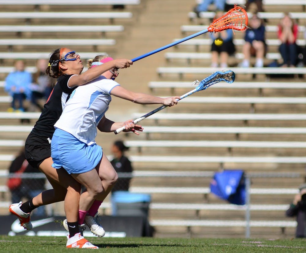 UNC Junior Attacker Abbey Friend (18) scores a goal in the first half. Abbey had 2 goals in the game.