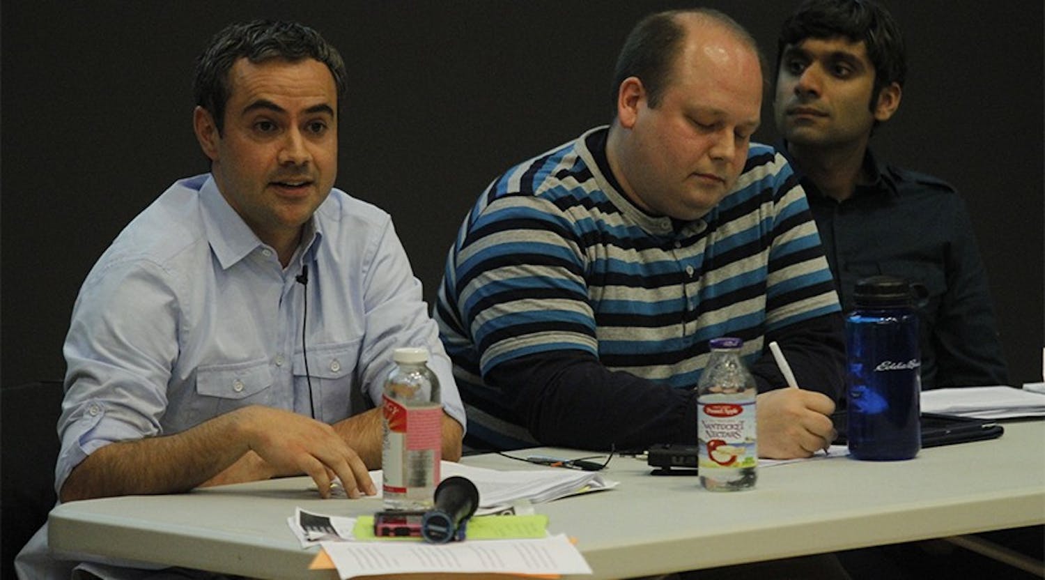 Yousuf Al-Bulushi, left, Nathan Swanson, middle, and Neel Ahuja participate in a forum.