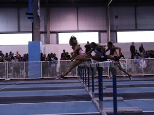 Runners compete in the women's hurdles event during the Dick Taylor Carolina Cup on Jan. 13 in Eddie Smith Field House.