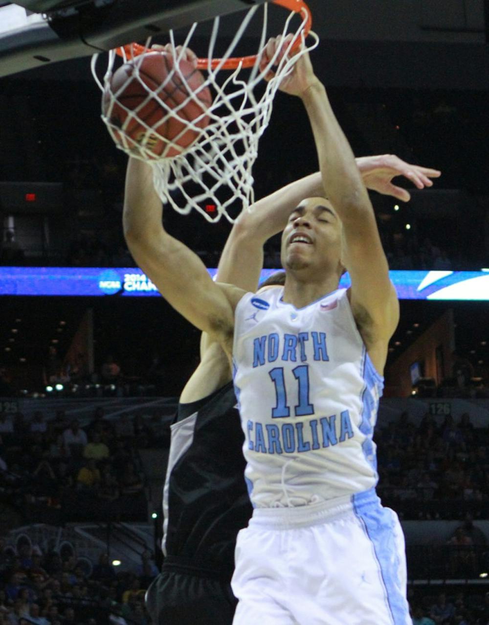 Brice Johnson dunks over a Providence player. UNC defeated Providence 79-77 in the second round of the NCAA tournament at the AT&T Center in San Antonio, TX. The Tar Heels advance to play in the third round on Sunday. 