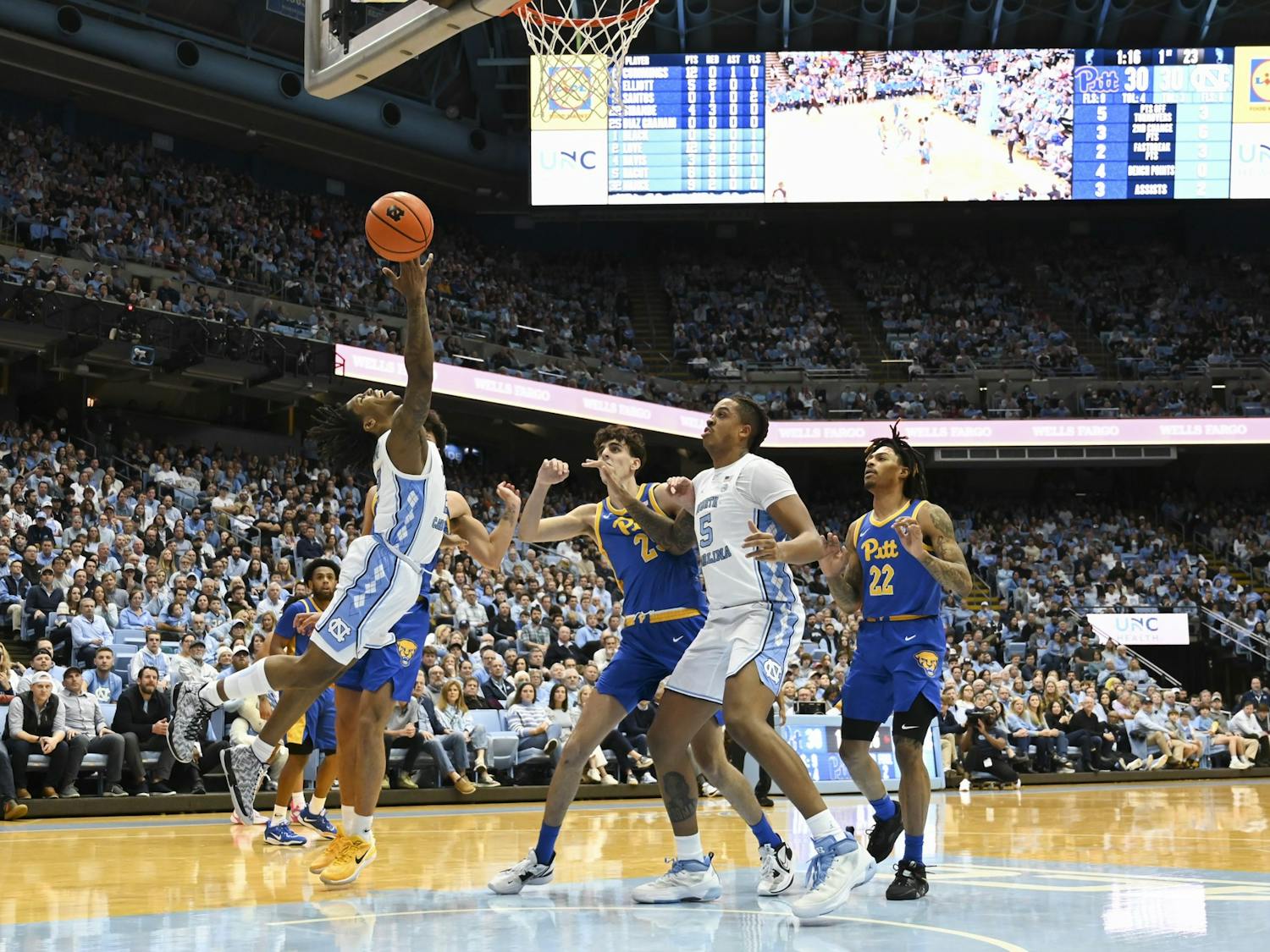 UNC junior guard Caleb Love (2) takes a shot during the men's basketball game against Pitt in the Dean Smith Center on Wednesday, Feb. 1, 2023. UNC lost 64-63.
