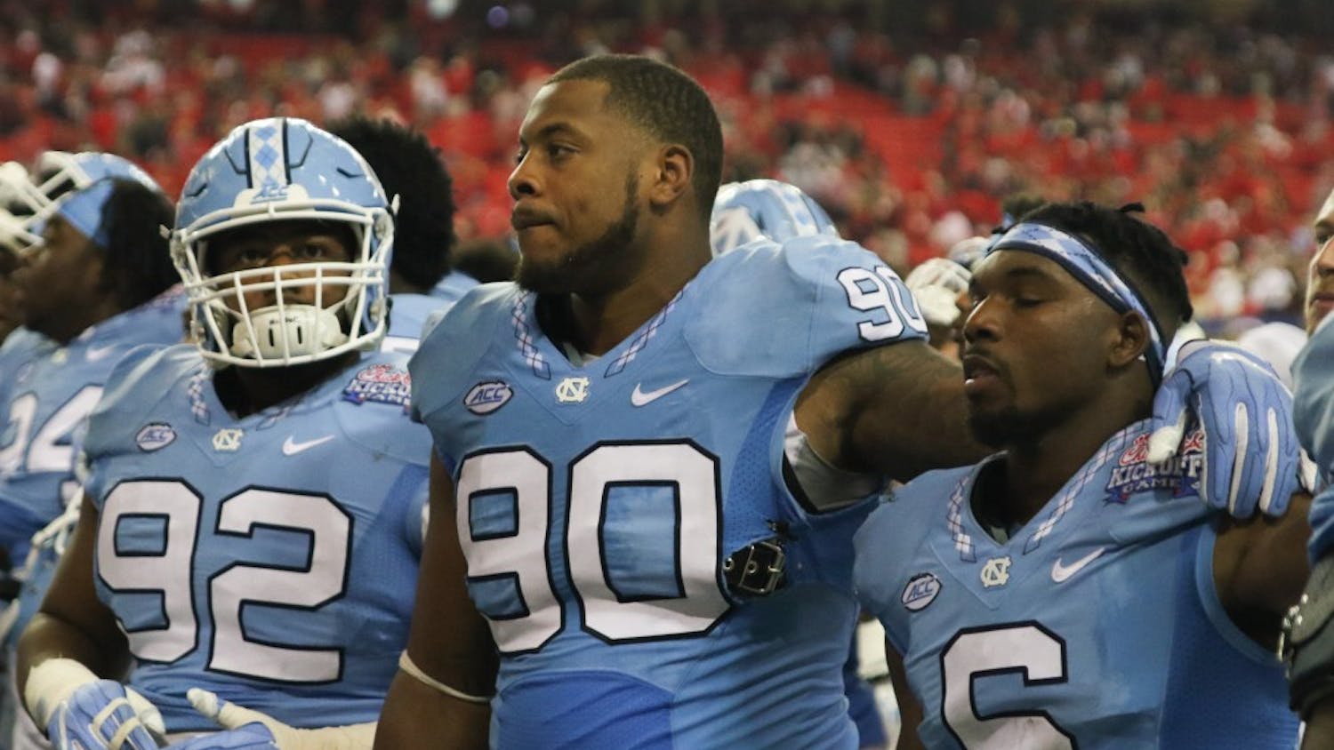 UNC defensive tackle Nazair Jones (90), and cornerback MJ stewart (6) show their disappointment after the team blows a ten point lead in the second half and falls to Georgia 33-24 in Atlanta on Saturday.