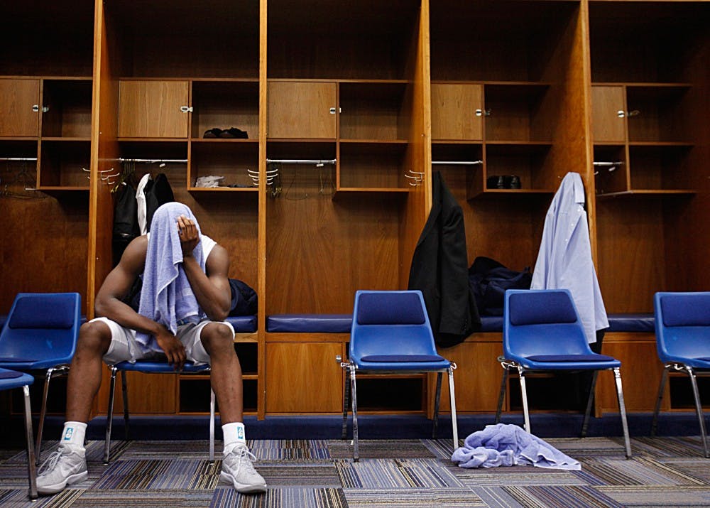 UNC forward Harrison Barnes shows his disappointment in the locker room after the game.