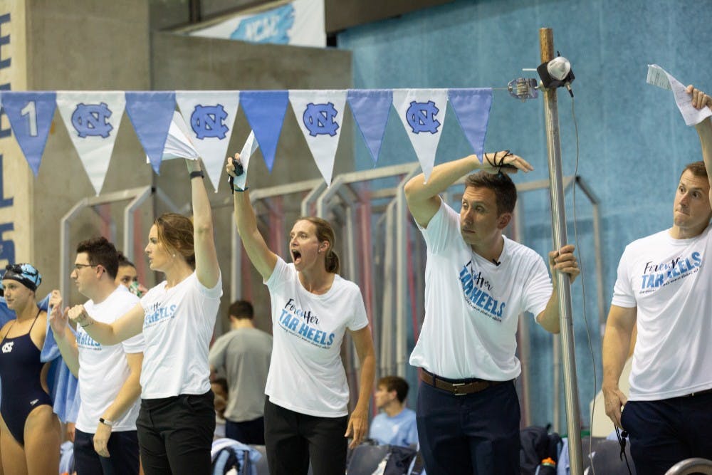 Mark Gangloff, UNC's head coach of the men's and women's swimming and diving programs, guides his team on Friday, Oct. 4, 2019 at his first meet as head coach. UNC claimed a victory over ECU at the Koury Natatorium in Chapel Hill.