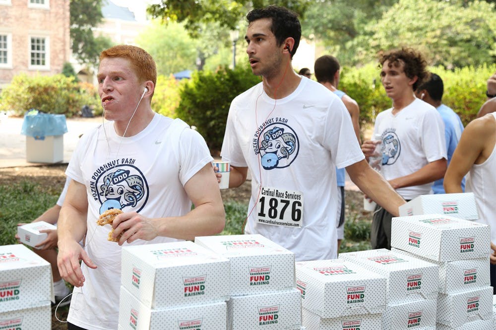 The Dozen Donut Dash began at the Old Well on Friday morning in September 2015. Participants had to run 2.5 miles before eating a dozen Krispy Kreme donuts and running another 1.5 miles. The race raises awareness and support for cancer patients.&nbsp;