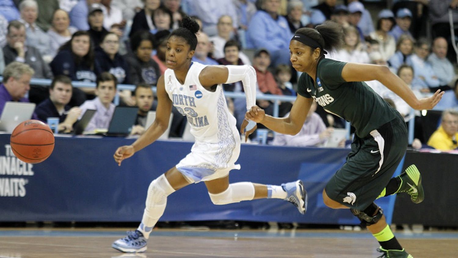 UNC guard Diamond DeShields (23) races for a loose ball against a Michigan State player. Carolina defeated Michigan State 62-53 on Tuesday in the NCAA Women's Basketball Tournament. 