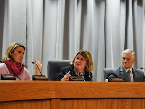 Chapel Hill Town Council members Jessica Anderson, Mayor Pam Hemminger, and Michael Parker vote during a meeting at Town Hall on Wednesday, Feb. 19, 2020.