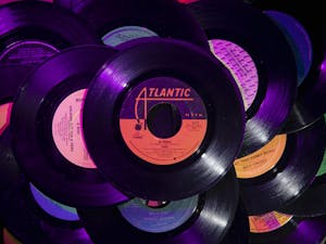DTH Photo Illustration. American music charts were once calculated from record store sales, but in the streaming age, the act of listening becomes a financial transaction.