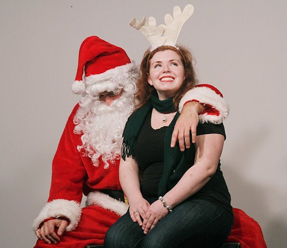 Kate Harlow tells Santa, Brad Taylor, what she wants for Christmas. DSI Comedy hosted "Love in the Time of Santa Claus" in Carrboro. This performance will happen every Saturday in December. 