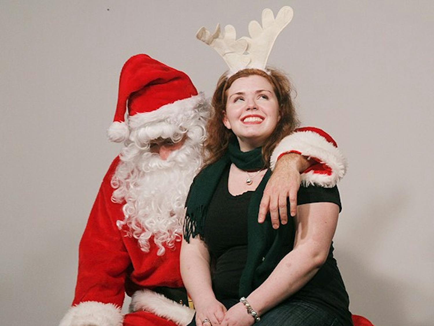 Kate Harlow tells Santa, Brad Taylor, what she wants for Christmas. DSI Comedy hosted "Love in the Time of Santa Claus" in Carrboro. This performance will happen every Saturday in December. 