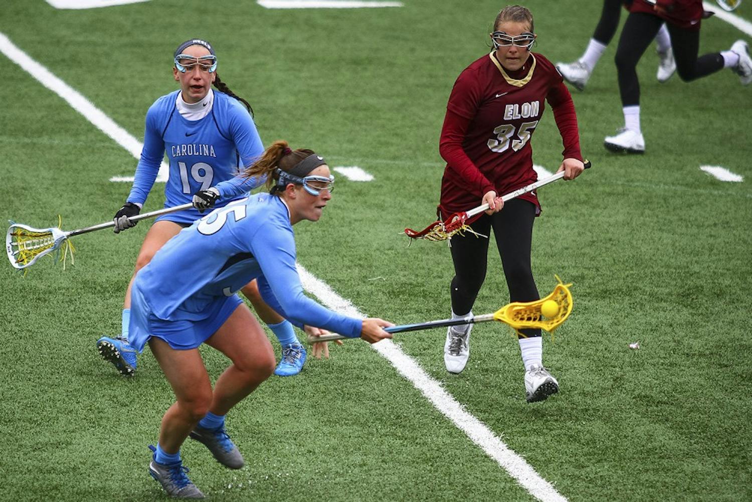 Senior defender Sarah Scott (19) chases the ball during the game against Elon on March 1. Scott had three fouls against Syracuse on Saturday, helping the Tar Heels defeat the Orange 15-8.