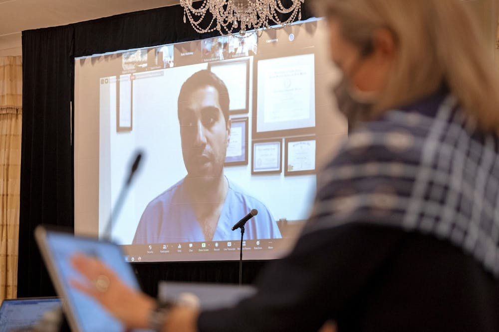 Dr. Amir Barzin addresses the board via Zoom during the UNC Board of Trustees full board meeting held at The Carolina Inn using COVID-19 protocols limiting the in-person attendance to 25 and having some participate via Zoom on Thursday, Nov. 12, 2020. Photo courtesy of Jon Gardiner.