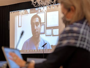 Dr. Amir Barzin addresses the board via Zoom during the UNC Board of Trustees full board meeting held at The Carolina Inn using COVID-19 protocols limiting the in-person attendance to 25 and having some participate via Zoom on Thursday, Nov. 12, 2020. Photo courtesy of Jon Gardiner.