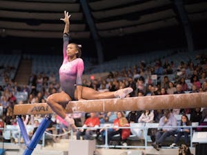 Khazia Hislop competes on the beam during home opener and annual Women's Day and Pink Meet against Oklahoma and Ball State on Saturday, Jan. 19, 2019. UNC placed second behind Oklahoma.
