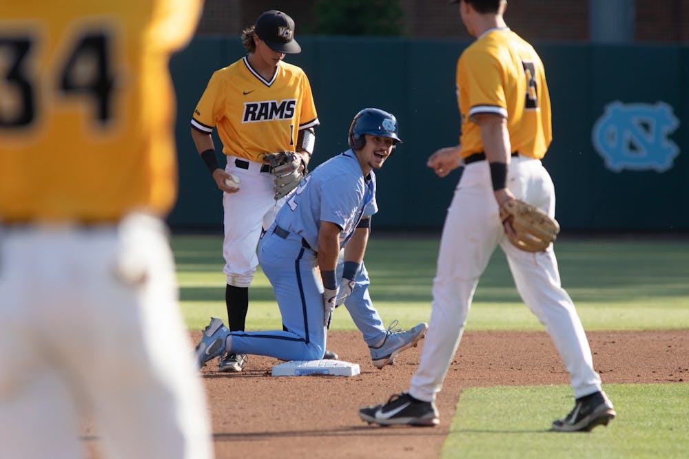 Sophomore catcher Tomas Frick (52) slides in safe to second base for a double during UNC's NCAA Regional against VCU at Boshamer Stadium on June 6, 2022.