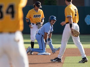 Sophomore catcher Tomas Frick (52) slides in safe to second base for a double during UNC's NCAA Regional against VCU at Boshamer Stadium on June 6, 2022.