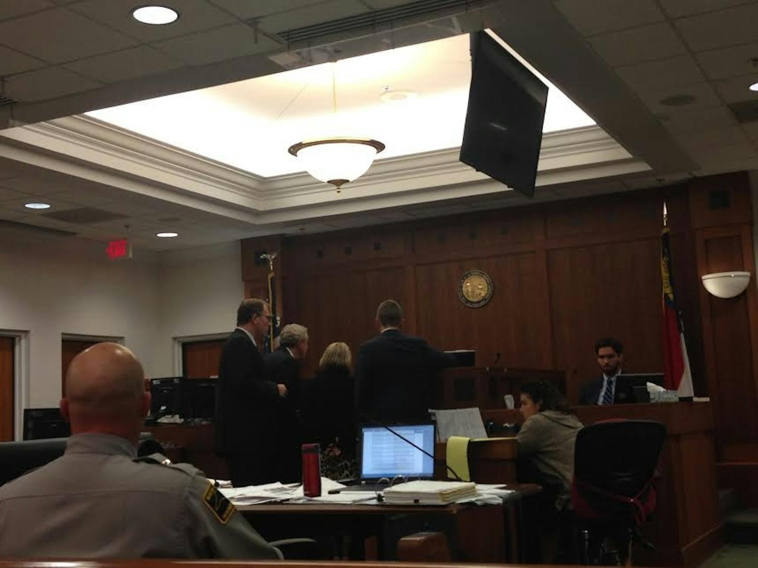 Prosecution and defense approach the bench during Chandler Kania's trial Friday.