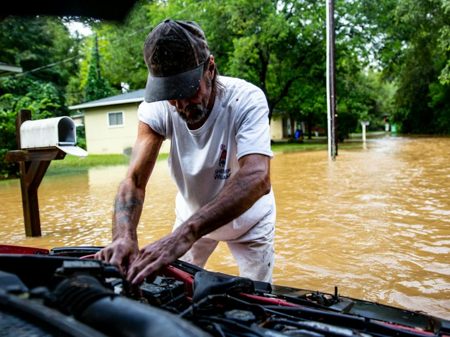 James Allen evacuated Jacksonville, NC ahead of Hurricane Florence in an effort to save what he could from the storm. He has spent the week at his friend's house in Chapel Hill and thought he had least spared his newly purchased car from the storm, knowing his home was likely destroyed. "That car is my lifeline. I work all over the state and need that car to pay my bills," Allen said. The neighborhood resting on a creek is subject to flooding but had been spared until the morning of September 17, 2018 when a sudden downpour of heavy rain forced creeks to crest in Chapel Hill around University Place.