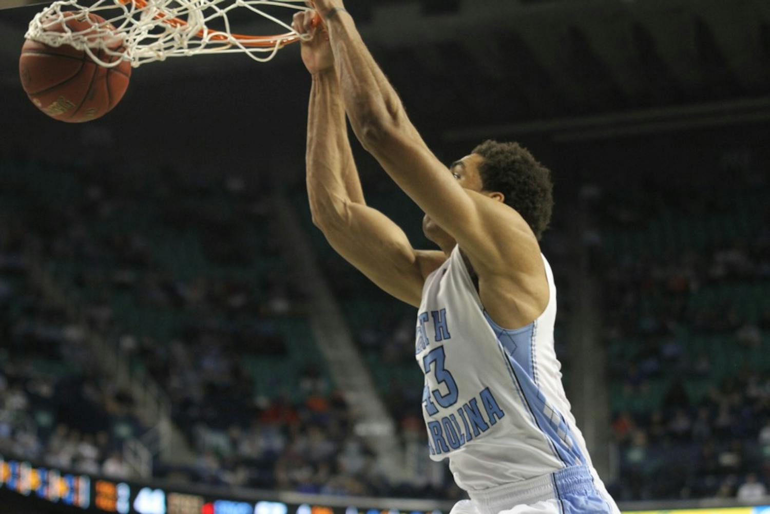 	James Michael McAdoo slams one down. McAdoo was assisted by a bounce pass from Marcus Paige.