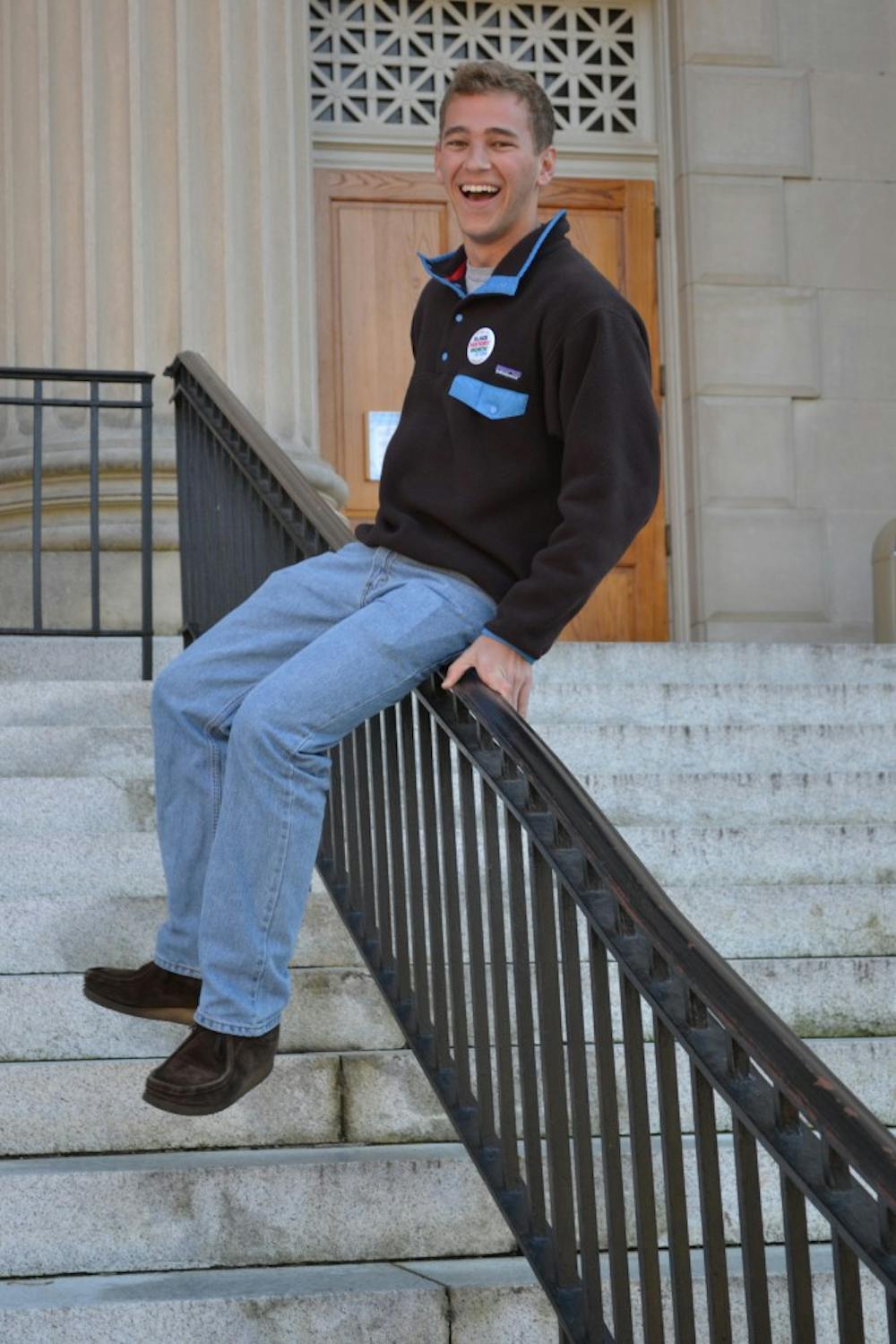 	<p>Will Leimenstoll slides down the banister in front of Wilson Library.</p>
