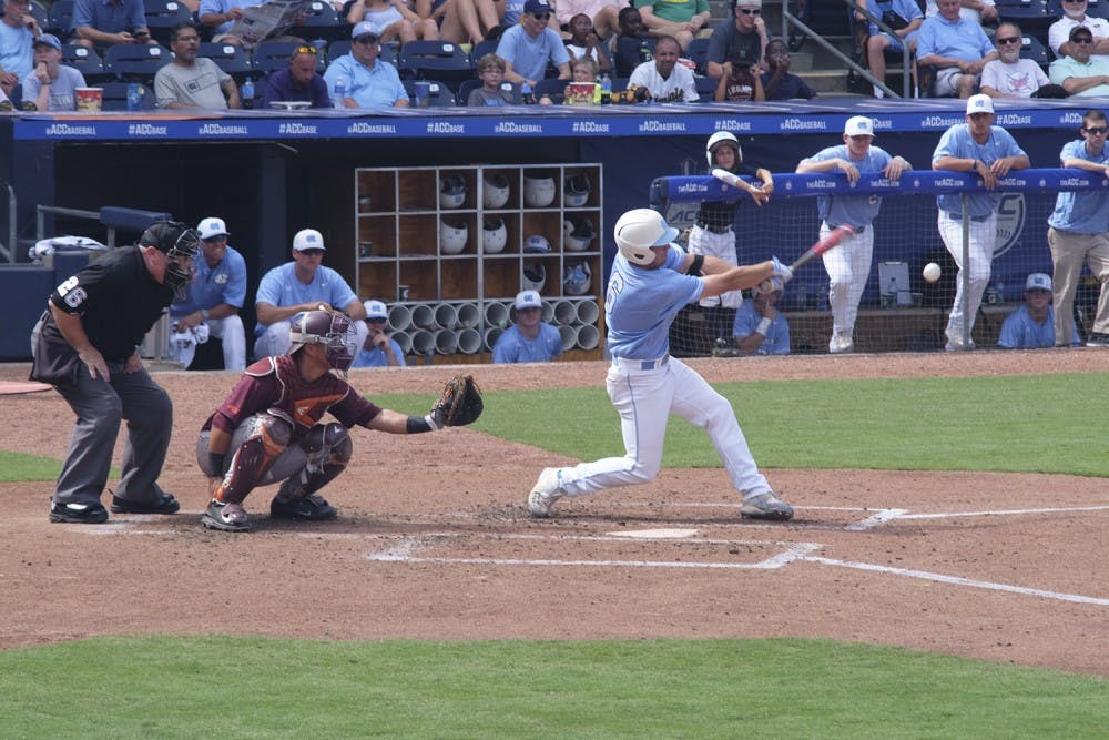 Alex Raburn makes contact with a pitch against Virginia Tech. 