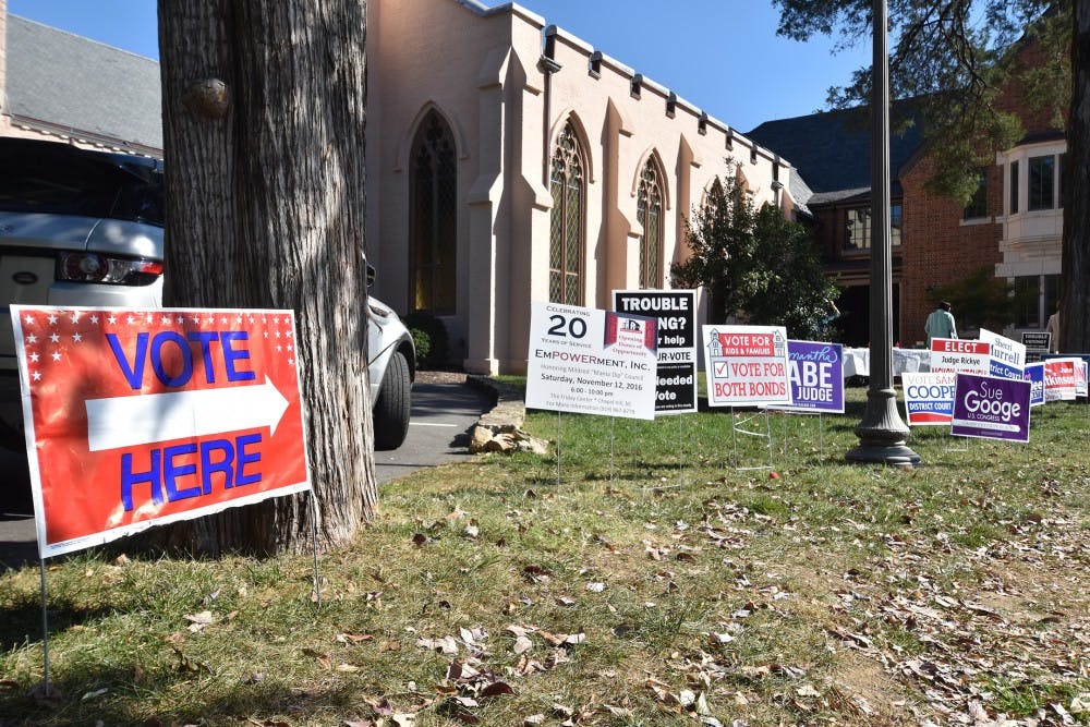 Students and local residents participate in early voting at Chapel of the Cross today. 