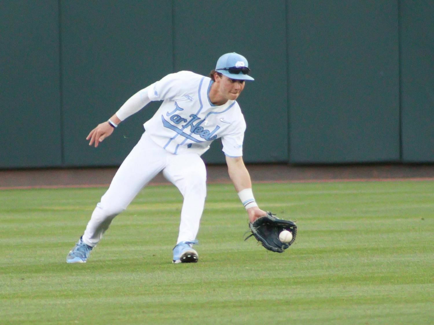 Outfielder Vance Honeycutt (7) goes to field a groundball during a baseball game against North Carolina A&T. UNC lost 6-7 at home on Tuesday, April 12, 2022.