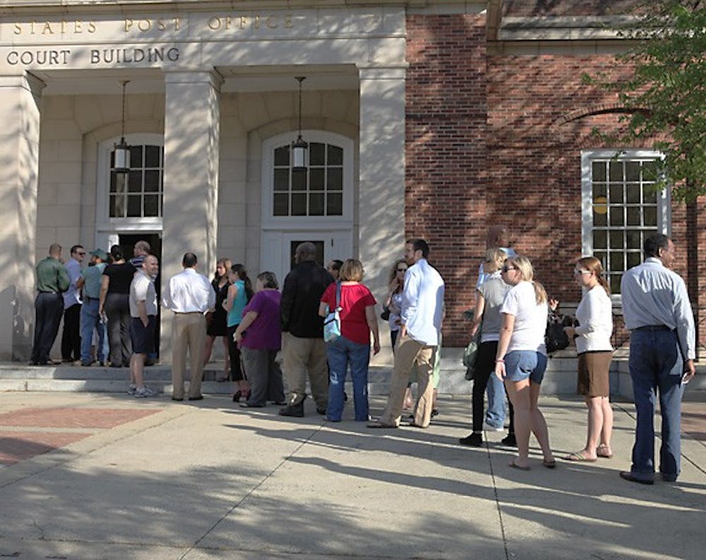 People wait in line outside the courthouse on Franklin Street Wednesday morning. DTH/Stephen Mitchell