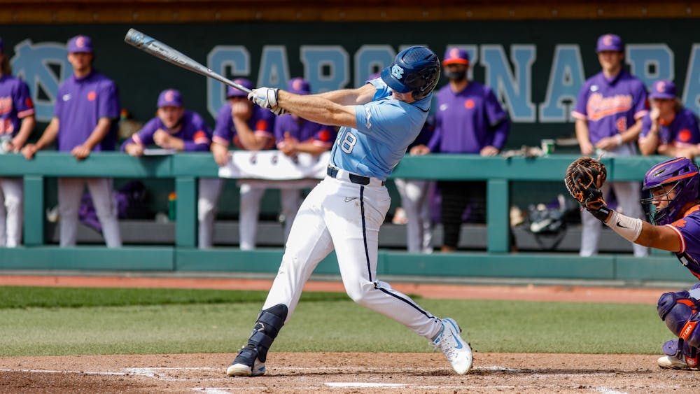 <p>UNC junior Clemente Inclan (18) swings the bat in a game against Clemson University at Boshamer Stadium on Sunday, March 14, 2021. The Tar Heels beat the Tigers 5-3. Photo courtesy of Abe Loven.&nbsp;</p>