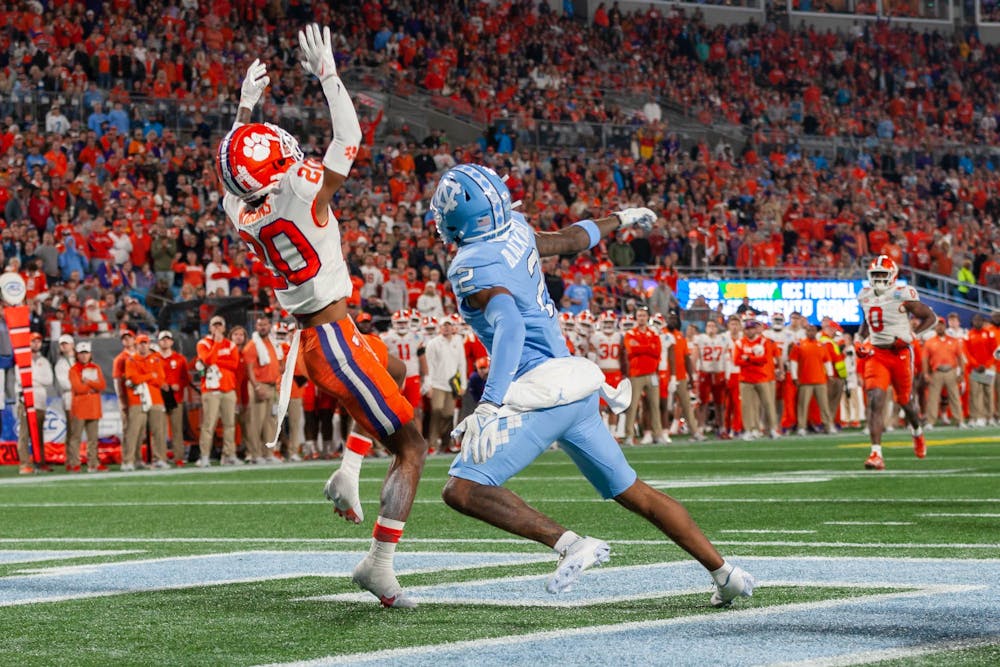 Clemson sophomore cornerback Nate Wiggins (20) intercepts a pass intended for UNC redshirt first-year wide receiver Gavin Blackwell (2) during the 2022 Subway ACC Football Championship Game against Clemson to begin at the Bank of America Stadium on Saturday, Dec. 3, 2022. UNC fell to Clemson 39-10.