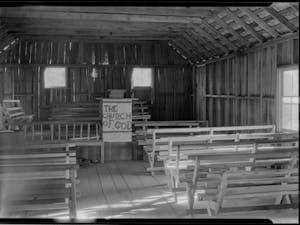 "The sinners will occupy the benches in the body of the church; the seats on the platform are for the Saints of Holiness." Photo by Bayard Wootten.