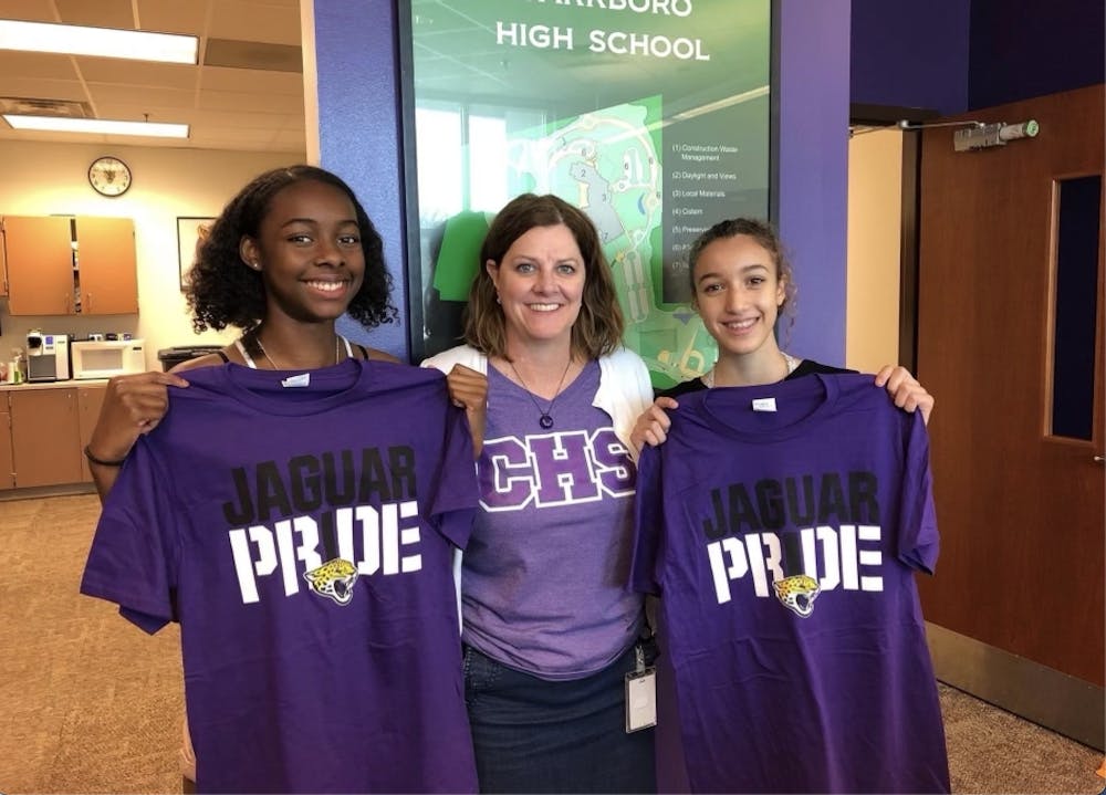 <p>Carrboro High School Principal Beverly Rudolph (center) announced her retirement from K-12 education on March 1. She is pictured with students Rekiyah Bobbitt (left) and Louise Lounes (right). Photo courtesy of Beverly Rudolph.</p>