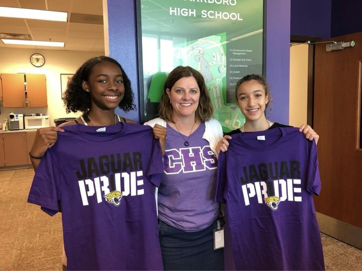 Carrboro High School Principal Beverly Rudolph (center) announced her retirement from K-12 education on March 1. She is pictured with students Rekiyah Bobbitt (left) and Louise Lounes (right). Photo courtesy of Beverly Rudolph.