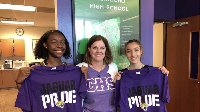 Carrboro High School Principal Beverly Rudolph (center) announced her retirement from K-12 education on March 1. She is pictured with students Rekiyah Bobbitt (left) and Louise Lounes (right). Photo courtesy of Beverly Rudolph.