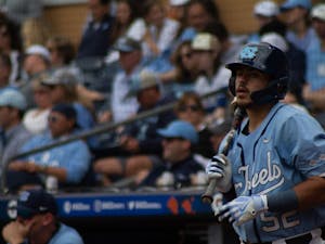 Junior catcher Tomas Frick watches an at-bat against the University of Virginia on Thursday, May 25, 2023. The Diamond Heels won 10-2.&nbsp;