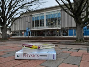 A stack of textbooks sits outside of UNC Student Stores on Tuesday, April 2, 2019.