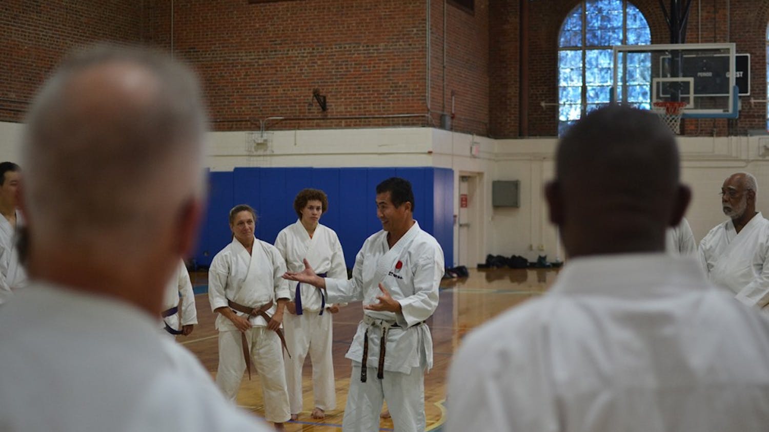 Sensai Nagatomo engages a diverse range of competitors at a UNC Shotokan Karate tournament Saturday afternoon.
