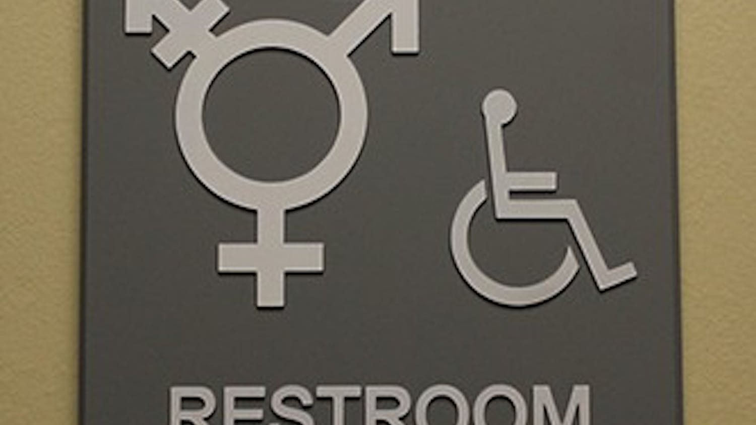 	A gender non-specific bathroom sign hangs outside a Campus Y bathroom.