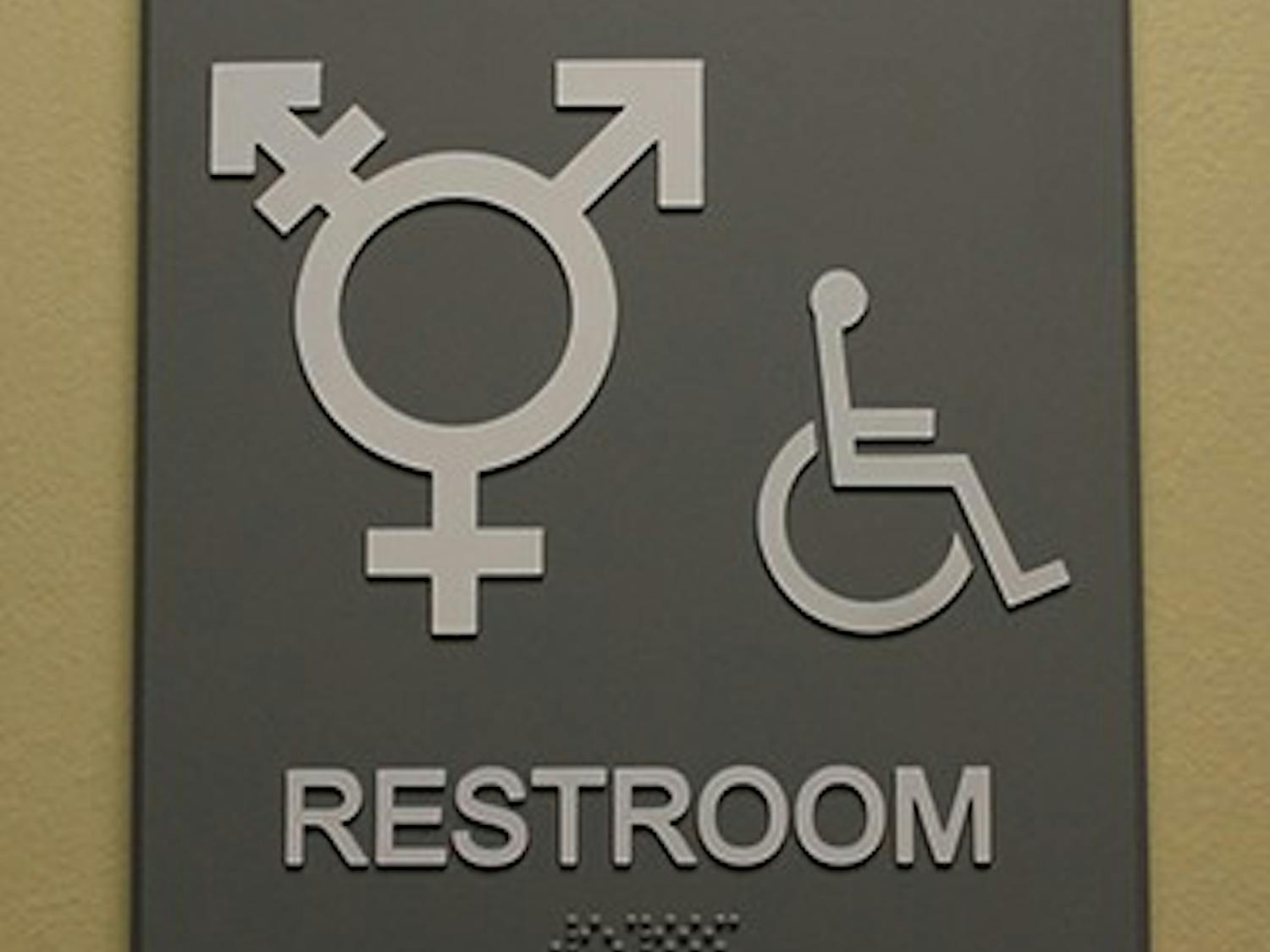 	A gender non-specific bathroom sign hangs outside a Campus Y bathroom.