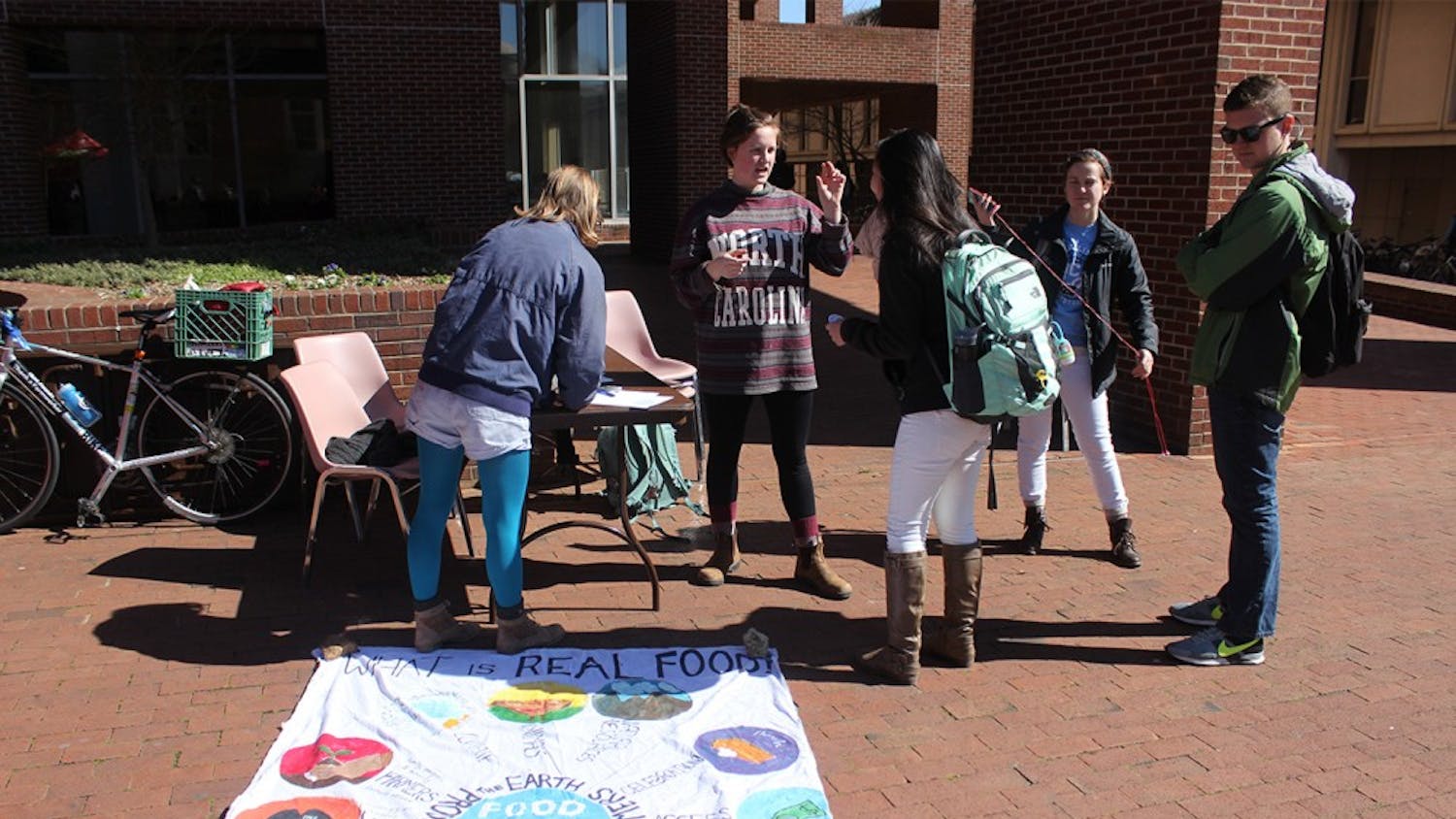 Members of UNC Real Food Challenge talked to students about what Real Food is and the group's goals for the semester in Davis Courtyard on Wednesday.