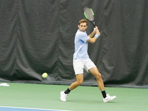 UNC Junior Benjamin Sigouin prepares to return the ball to Georgia State Roberts Grinvalds in the Cone-Kenfield Tennis Center on Sunday, Jan. 26, 2020. The Tar Heels won 4-0.