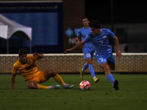 UNC Freshman Sam Williams (7) steals the ball during the men's soccer game against East Tennessee State on Tuesday, Sept. 13, 2022, at Dorrance Field.