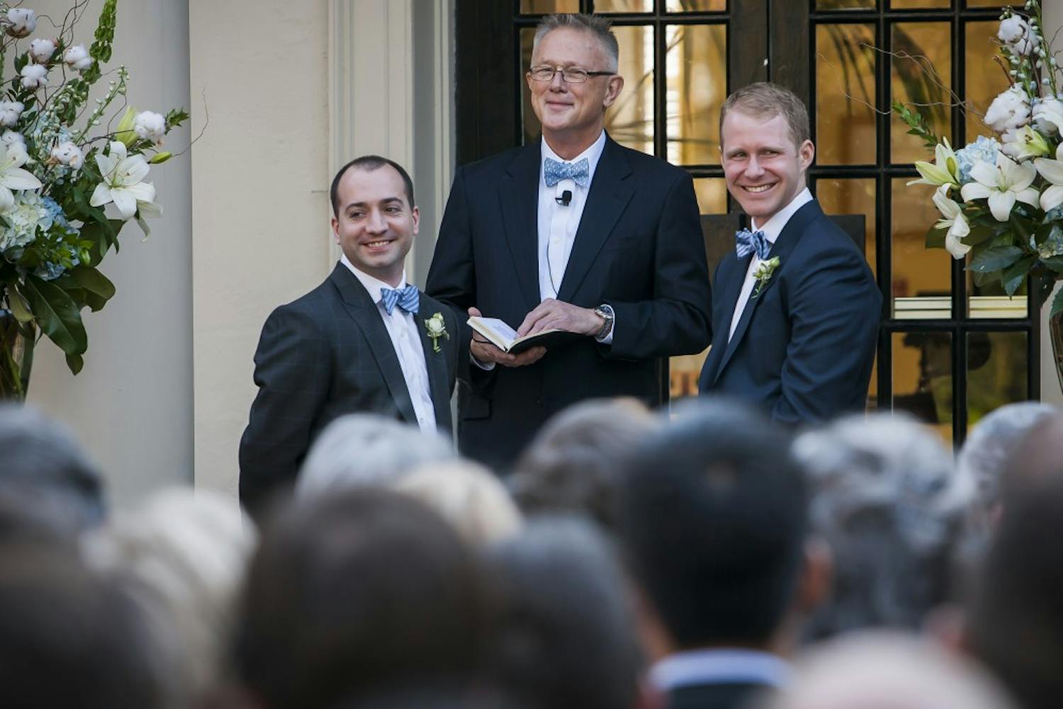 FROM LEFT: Zach Howell, officiant Dr. Jesse L. White Jr, and Garrett Hall (ALL CQ) during the first same-sex wedding ceremony ever at The Carolina Inn in Chapel Hill, NC.  on April 6, 2013.